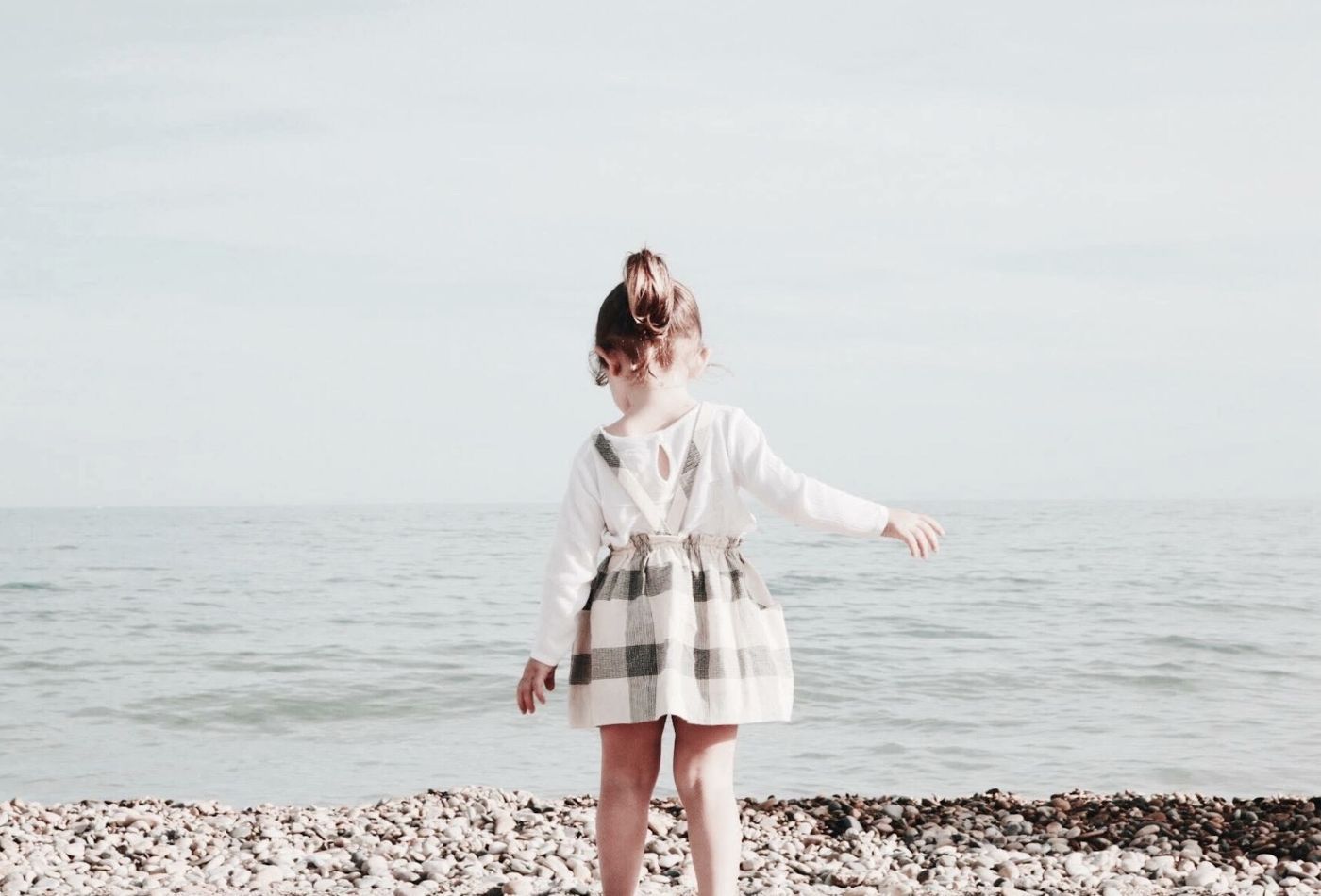 girl on beach in lyme regis