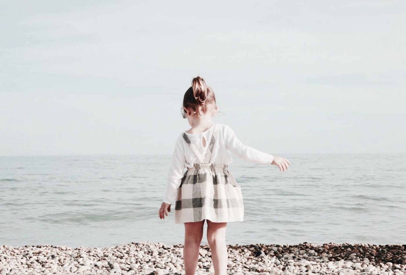 girl on beach in lyme regis