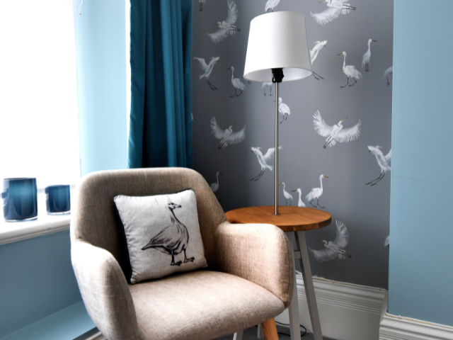 Armchair in blue and grey living room