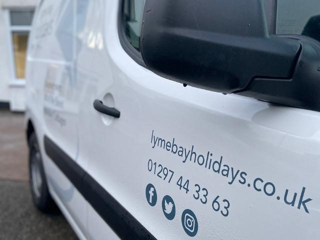 Lyme Bay Holidays signage on one of the managed services vans. Lyme Bay Holidays - Dorset Letting Agent