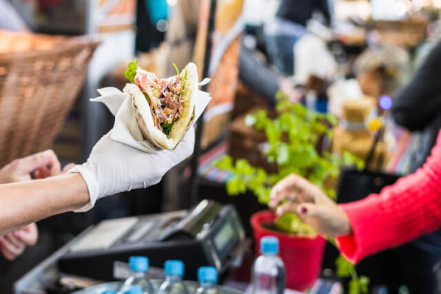 Customer grabbing food at Dorset event