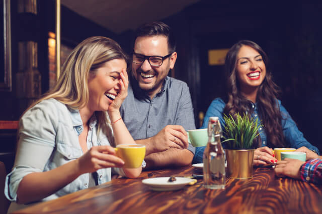 Friends drinking coffee together