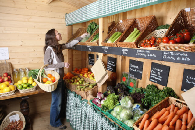 Woman choosing fresh fruit and veg