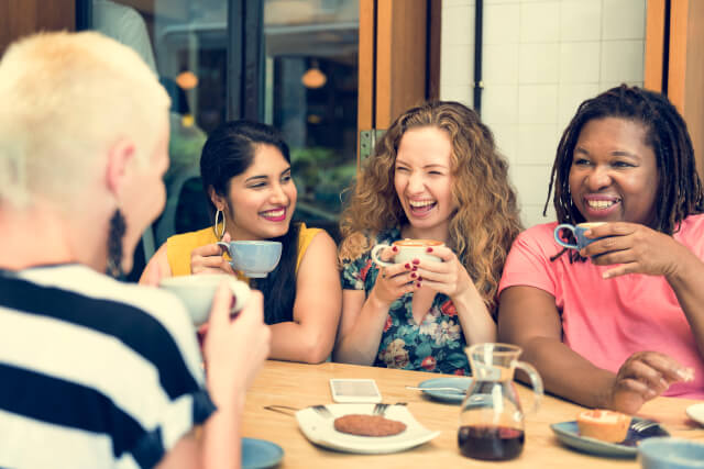 Young women enjoying coffee