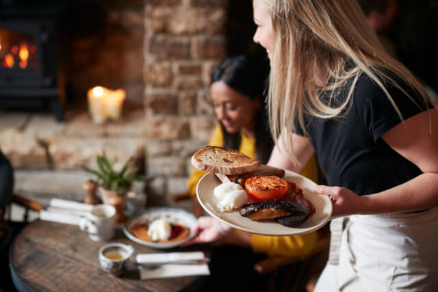 Waitress serving in Charmouth pub