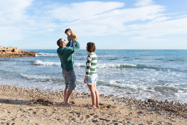 Family having fun at the beach