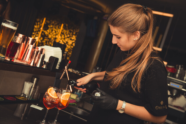 bartender pouring aperol