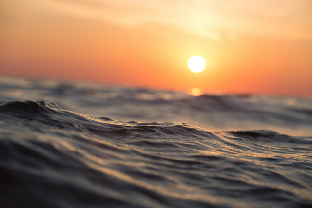 Close-up of wave at sunset