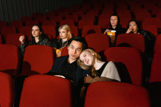 Couples watching screening at theatre