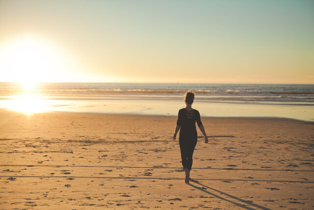 Woman walking on Hive Beach