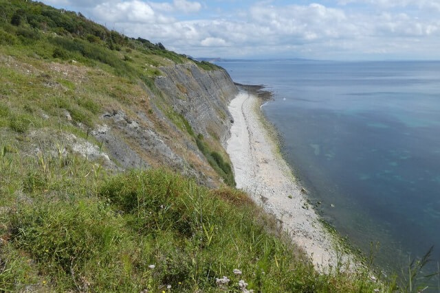 Looking down from the cliffs to Pinhay Bay Beach in Dorset